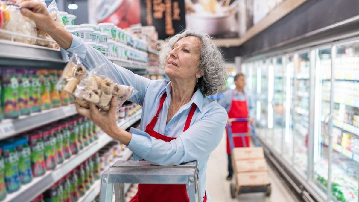 Woman working in grocery store.