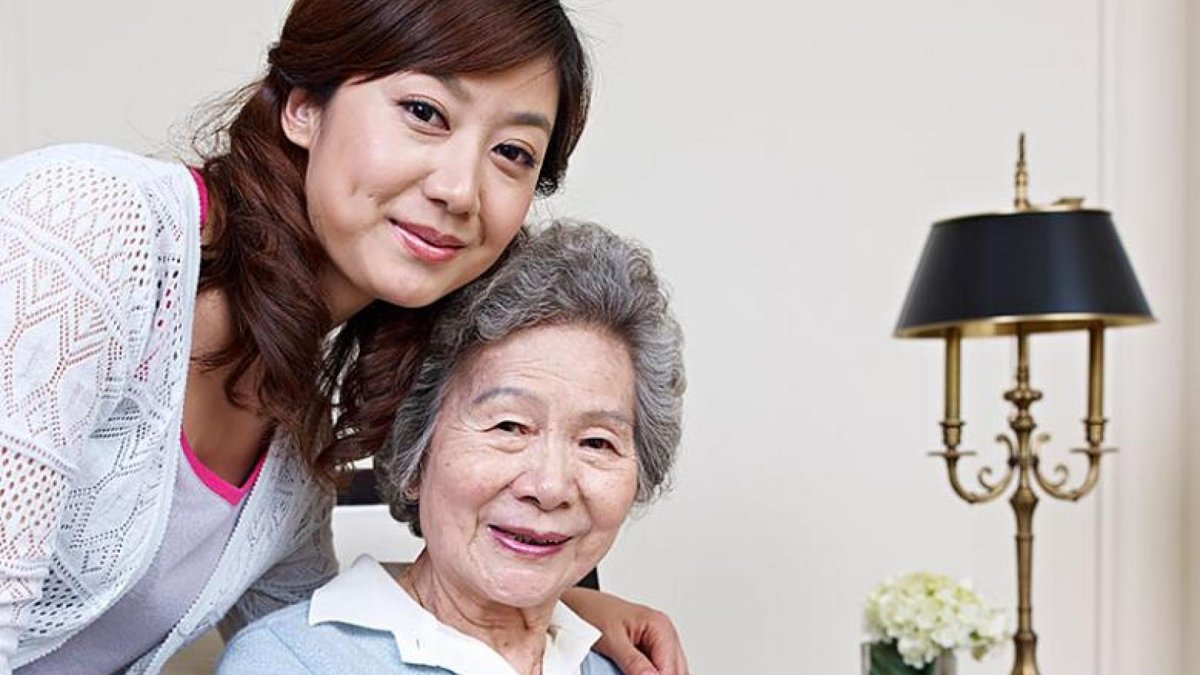 A senior woman and her daughter.