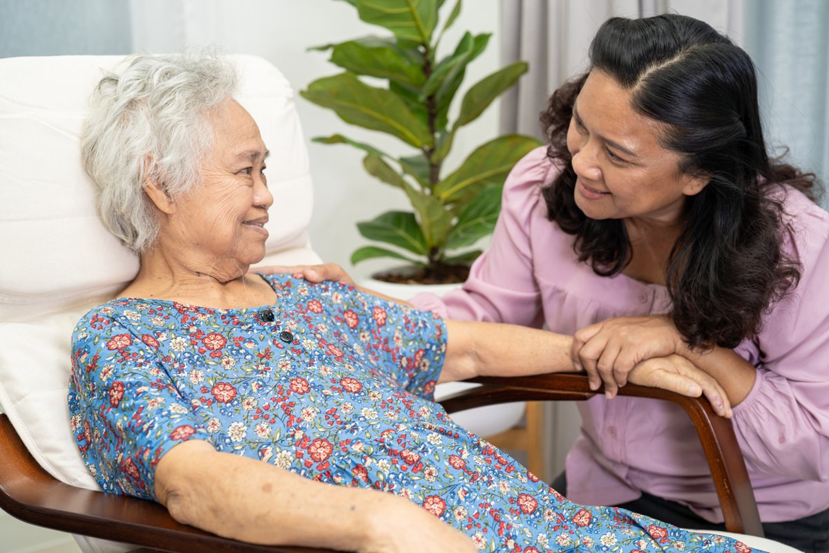 Woman visits with her mother.