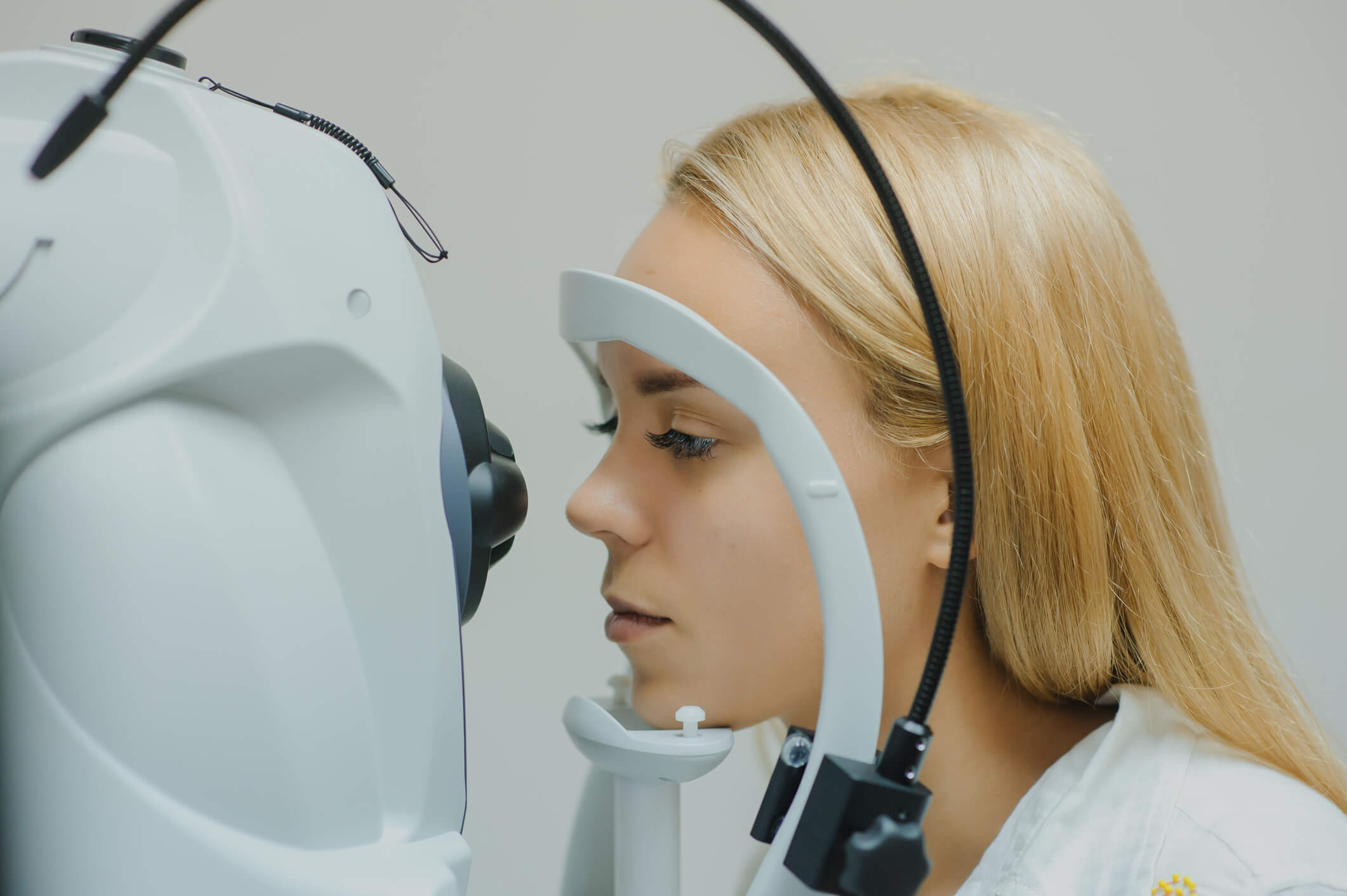 A patient prepares to have an optic nerve imaging test using optical coherence tomography.