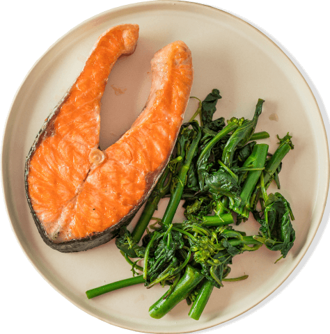 Salmon and greens on a plate.