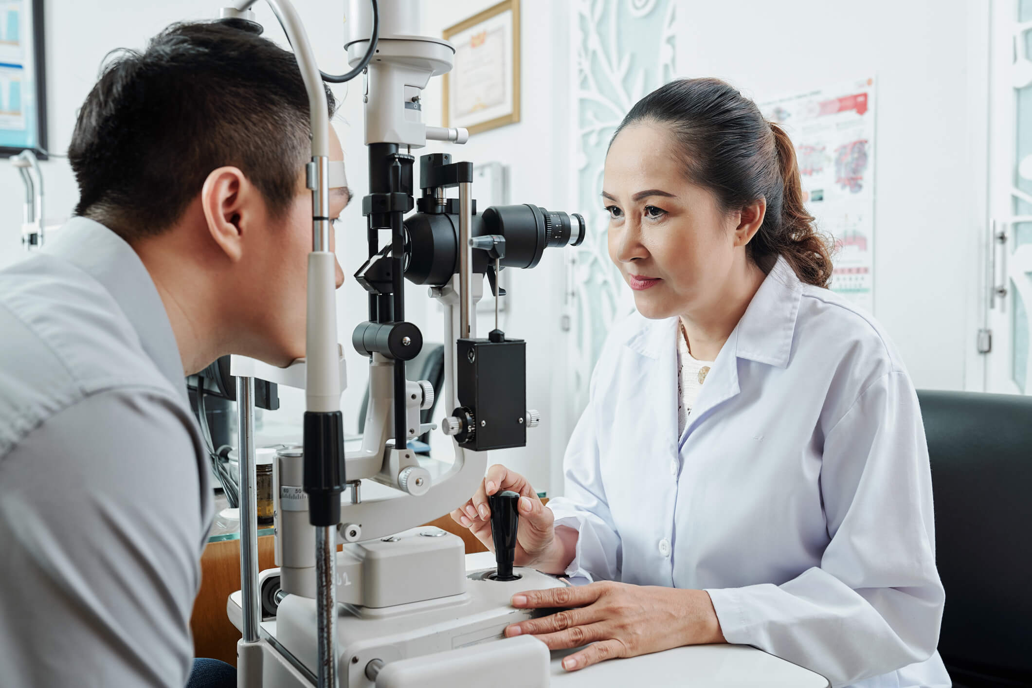 A man having an eye exam with his eye doctor.