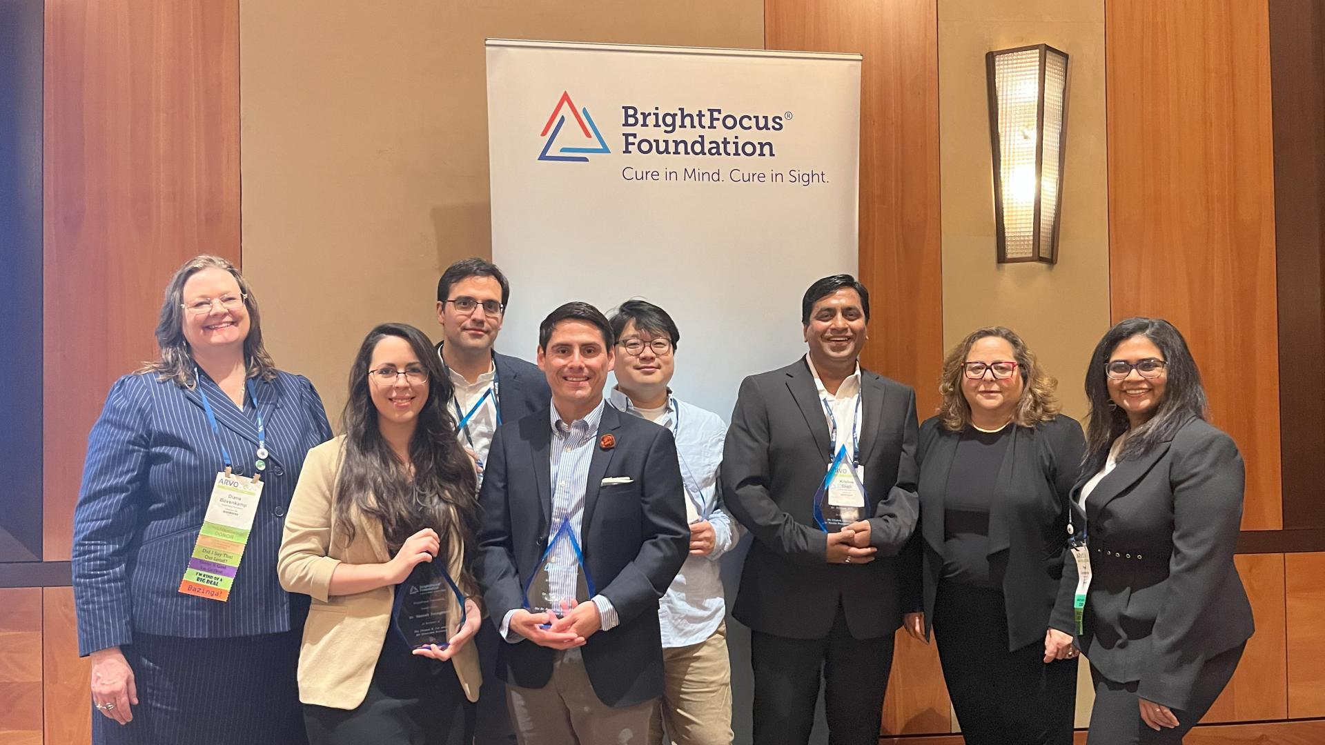 Group photo of ARVO awardees with Diane Bovenkamp, PhD, Preeti Subramanian, PhD, and Stacy Pagos Haller of BrightFocus Foundation. From left: Diane Bovenkamp, PhD, BrightFocus; Hannah Youngblood, PhD; Miguel Flores Bellver, PhD; Samuel Herberg, PhD; John Han, PhD; Krishna Singh, PhD; Stacy Pagos Haller, President and CEO, BrightFocus; and Preeti Subramanian, PhD, BrightFocus.