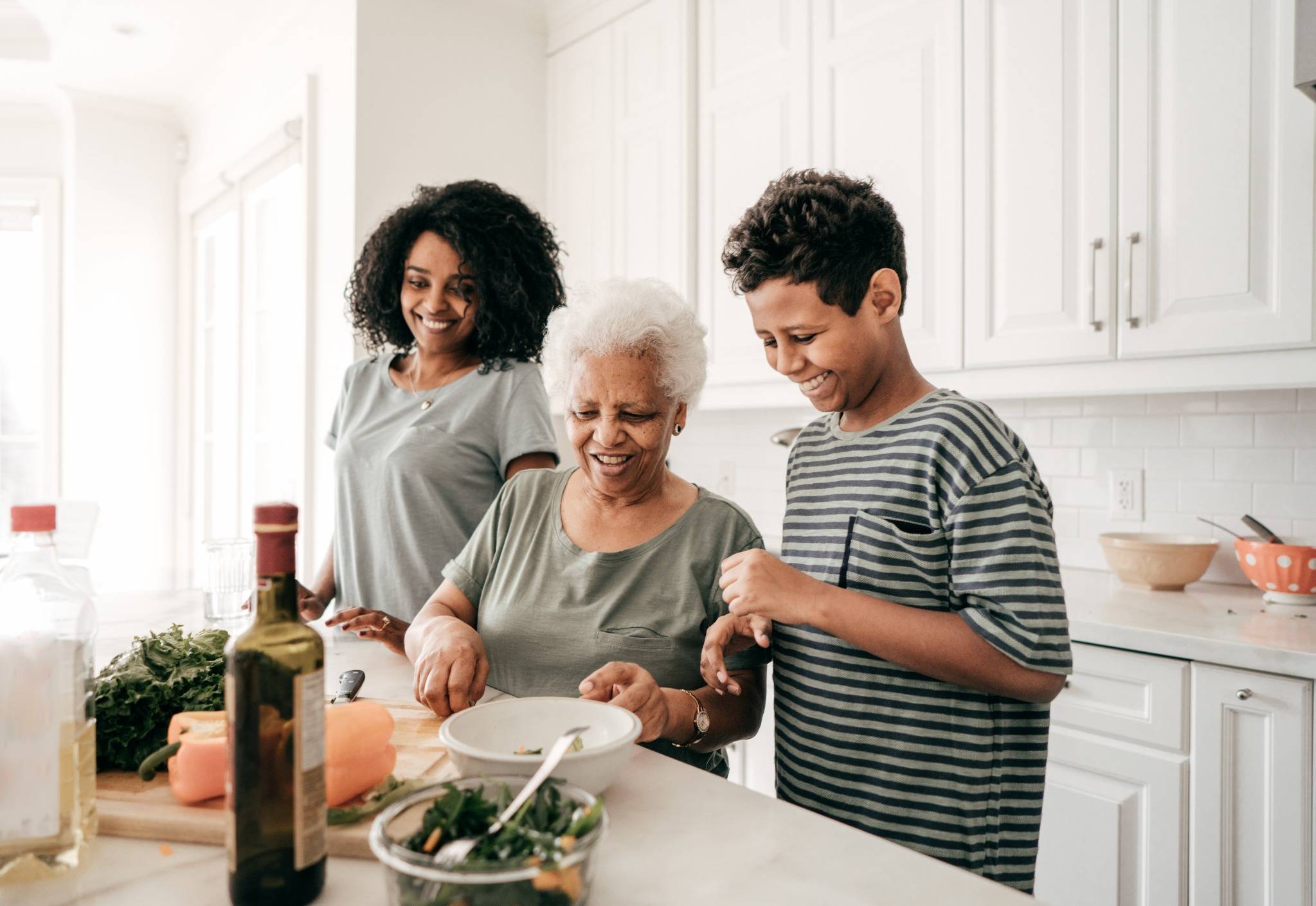 Family of three cook together.