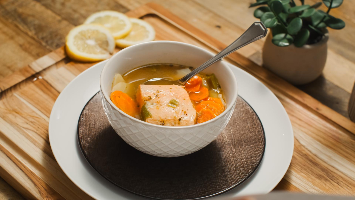 Salmon soup in a white bowl