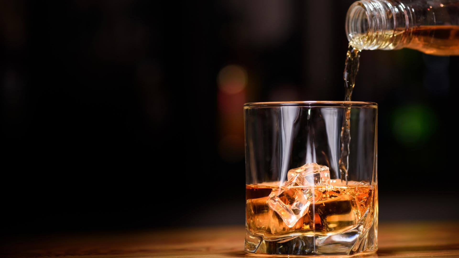 Whiskey being poured into a glass