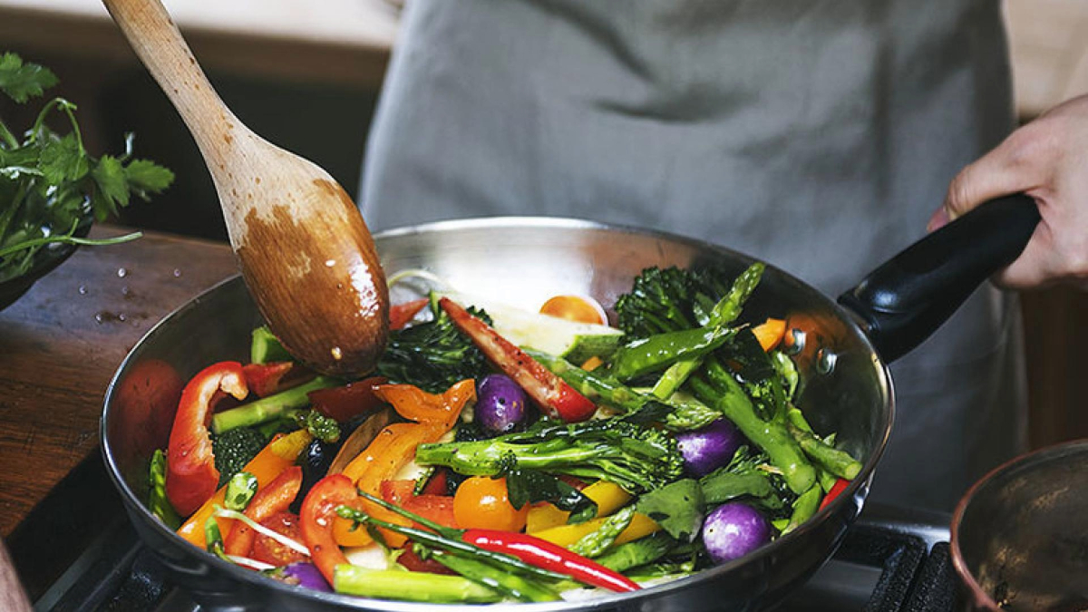 Cooking vegetables in a skillet.