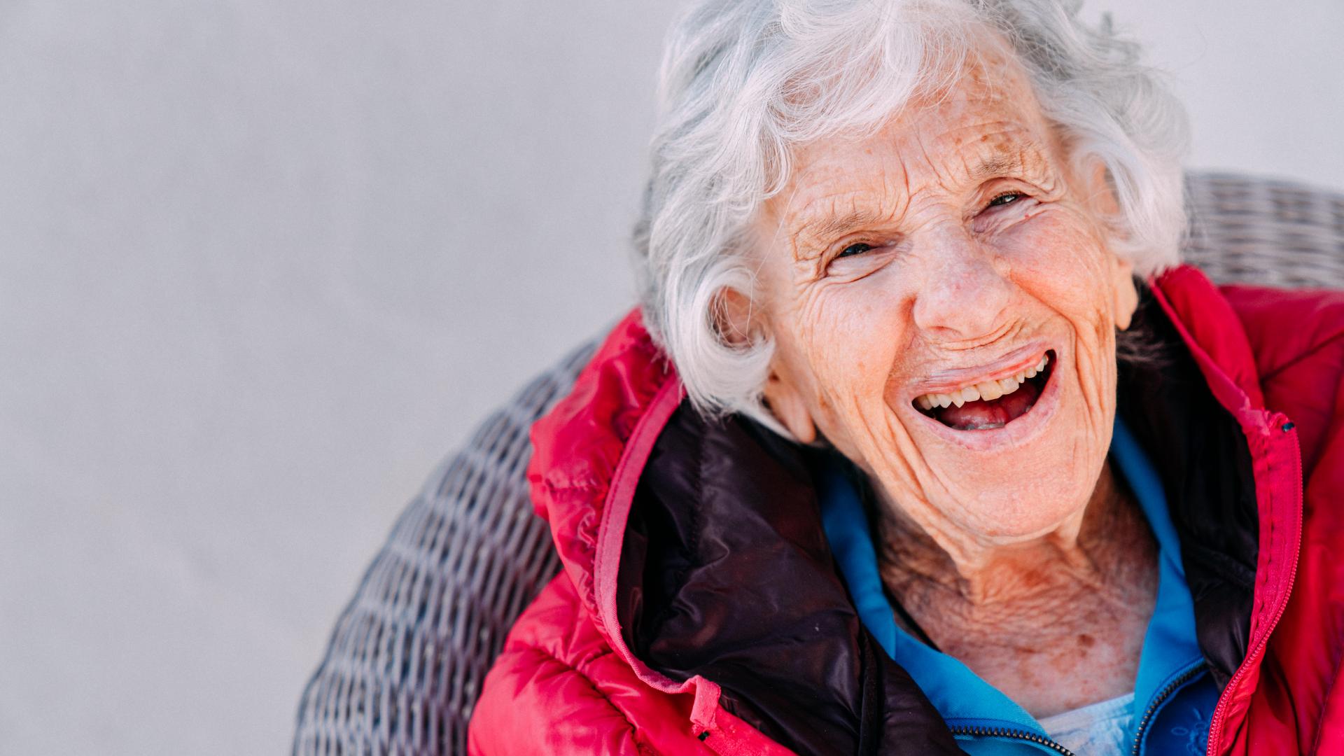 A smiling elderly woman.