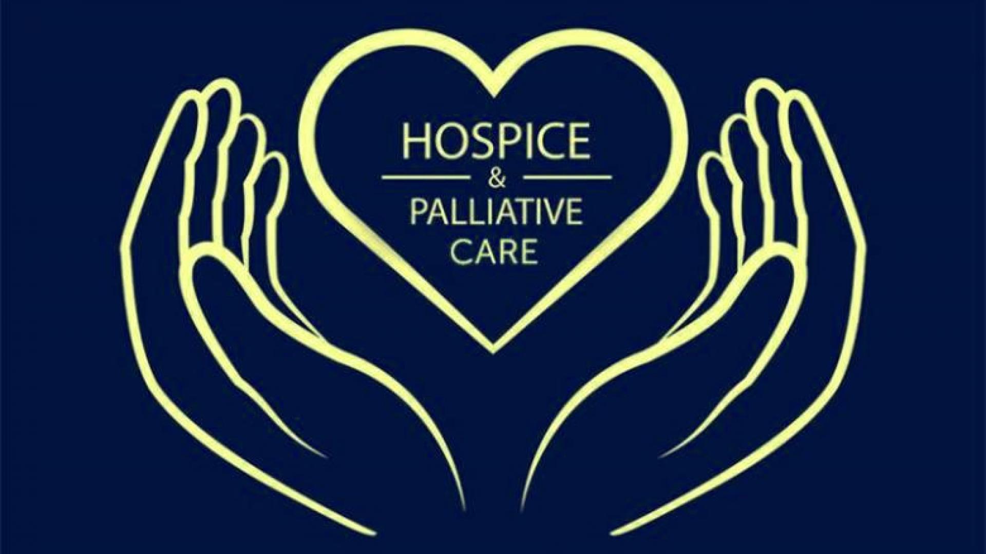 an outline of a pair of hands holds a heart that reads "hospice and palliative care"