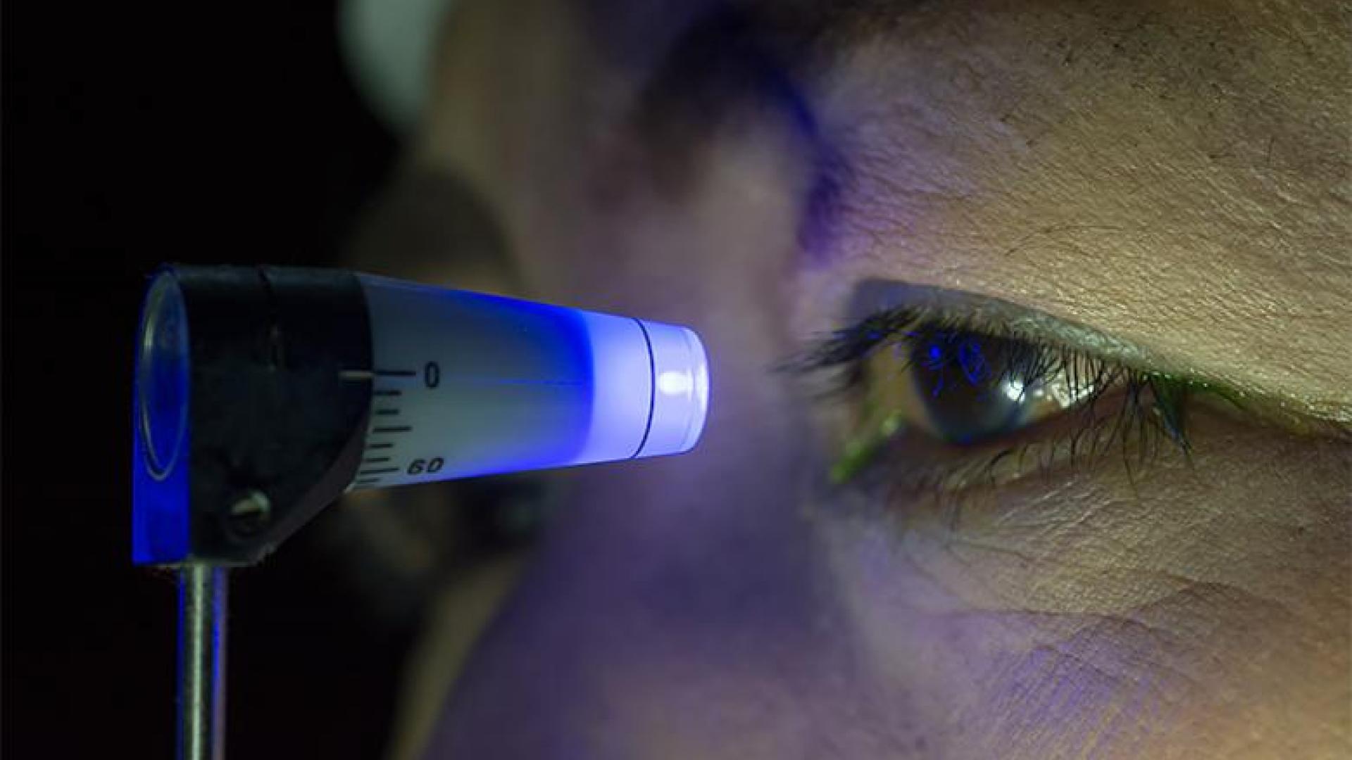 a close-up of an eye undergoing eye pressure measurement