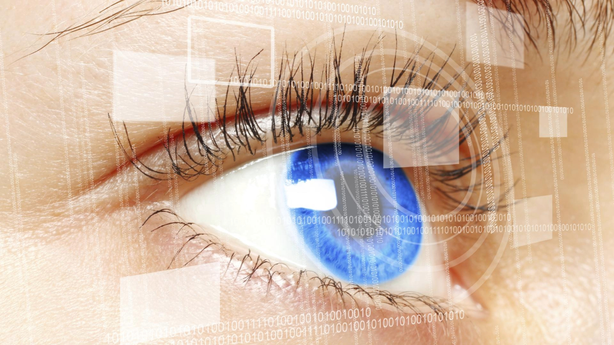 Close-up of a human eye overlaid with digital binary code, symbolizing technology and data concepts.