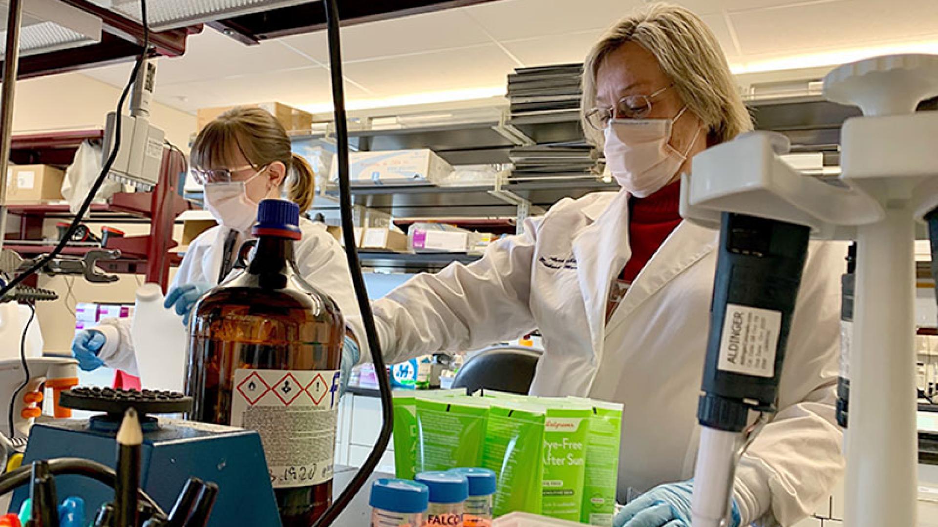 Two women scientists working in the lab.