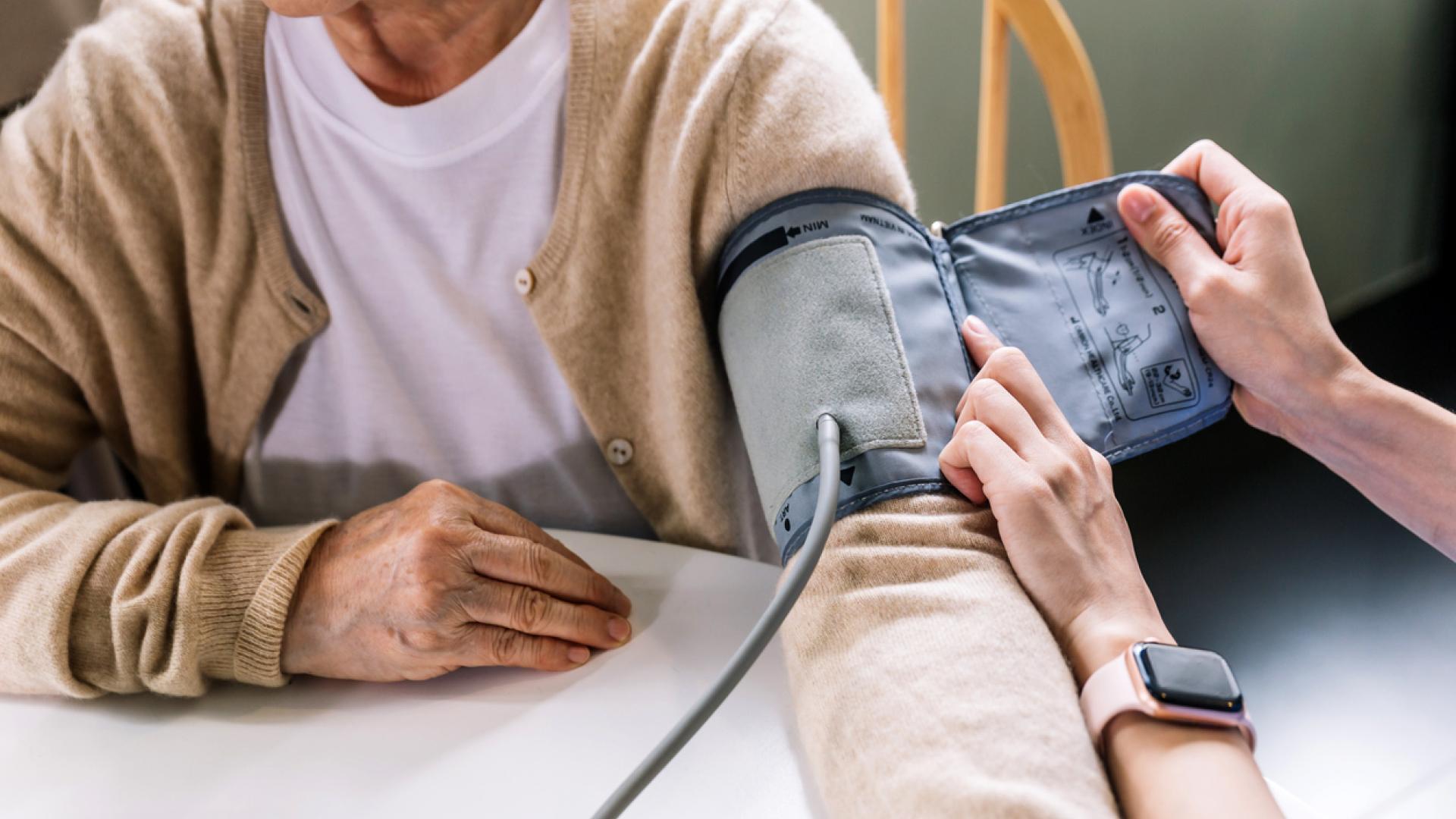 a blood pressure cuff being placed on someone's arm