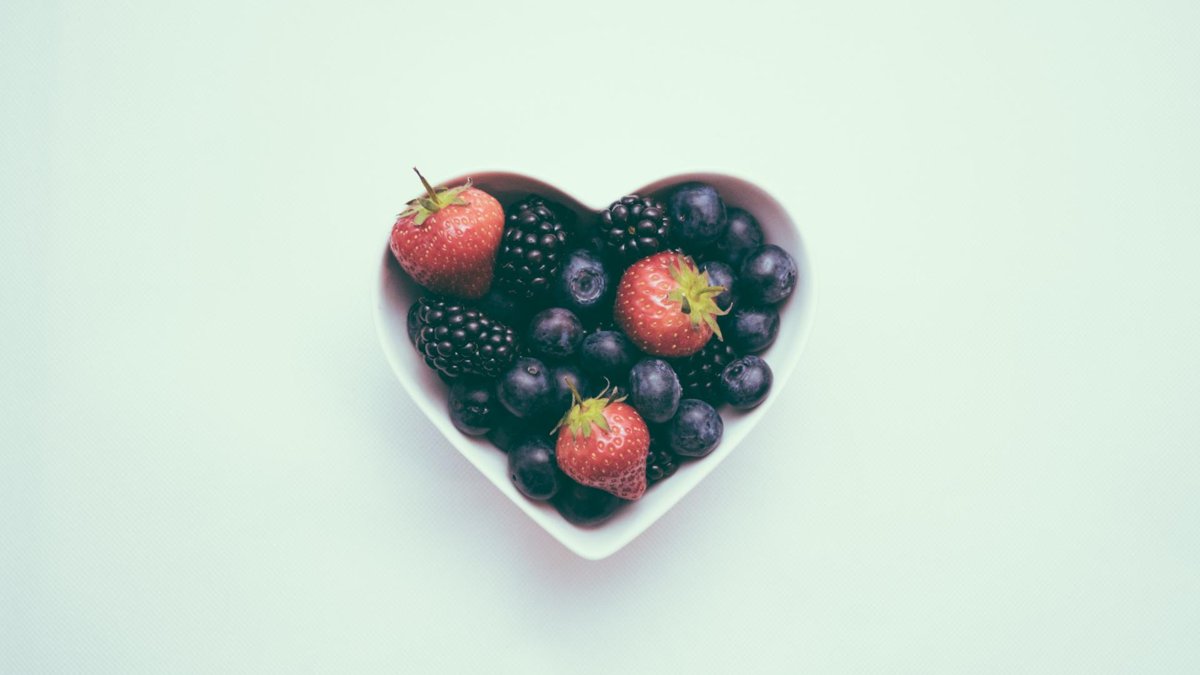 A heart shape filled with blueberries and strawberries.