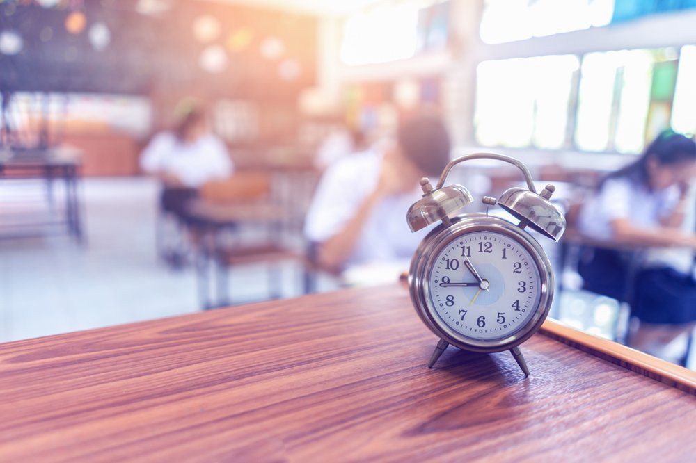 A clock sitting on a table.