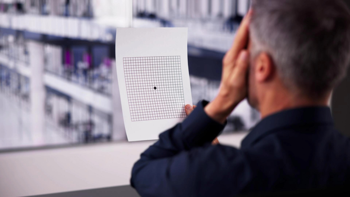 A man using the amsler grid eye test.