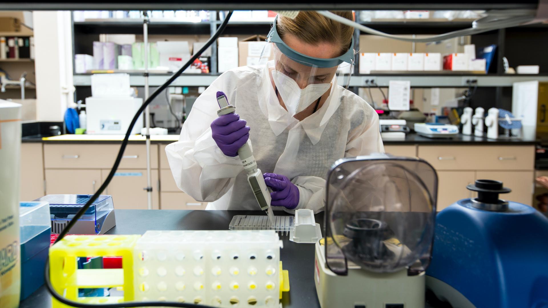 A scientist working in the lab.