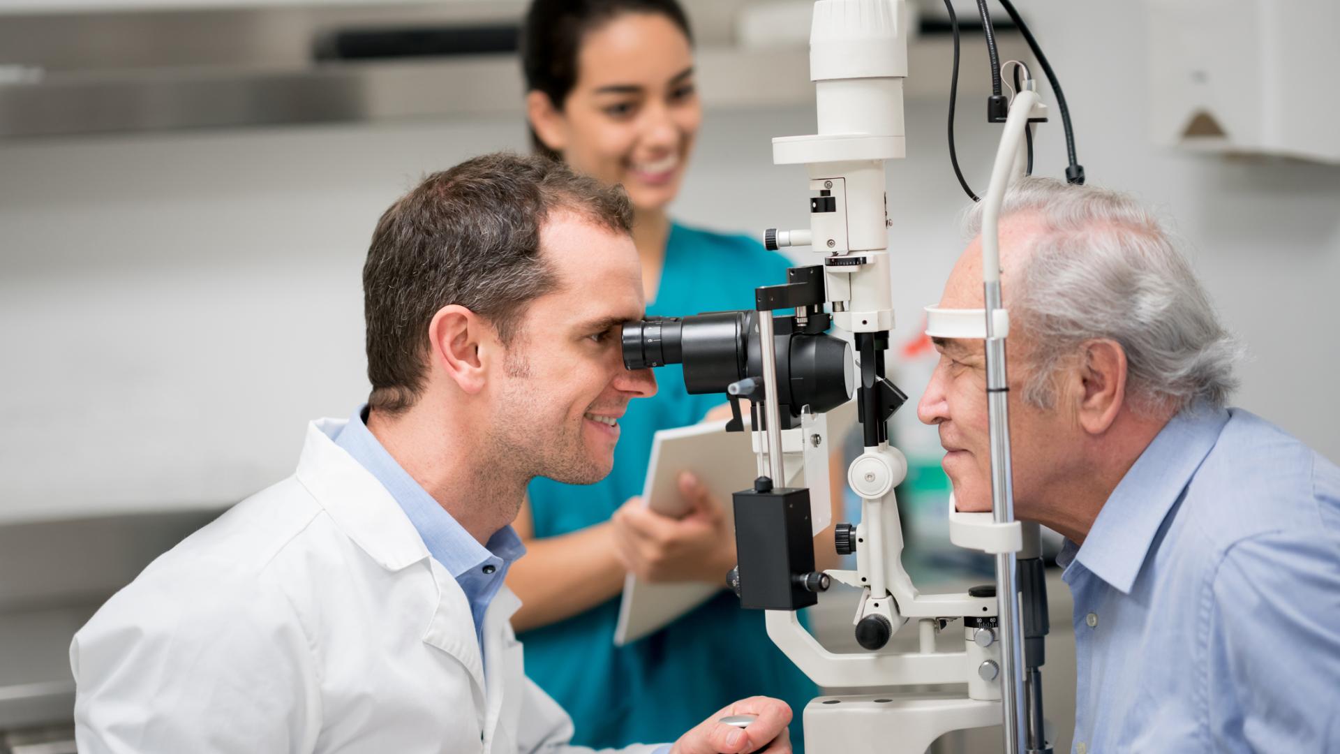 a doctor giving an elderly patient an eye exam