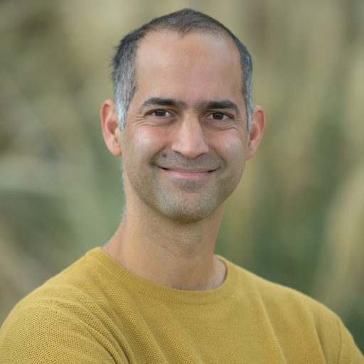 a headshot of Dr. Gilad