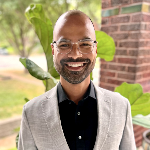 a headshot of Dr. Sharma