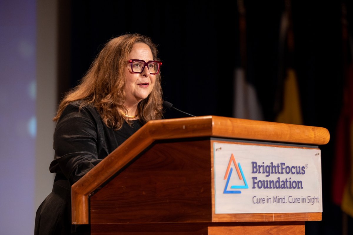 Stacy Pagos Haller speaks at a podium