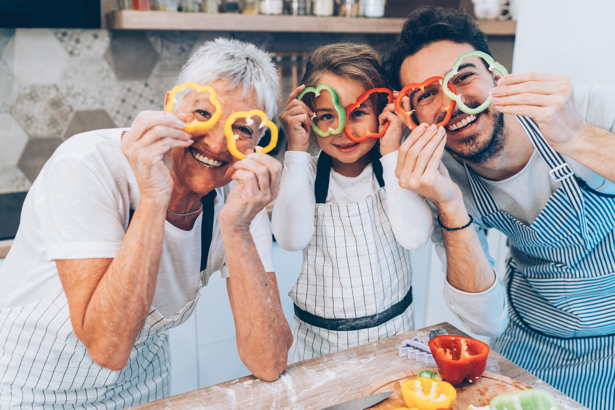 A multigenerational family cooking in the kitchen.