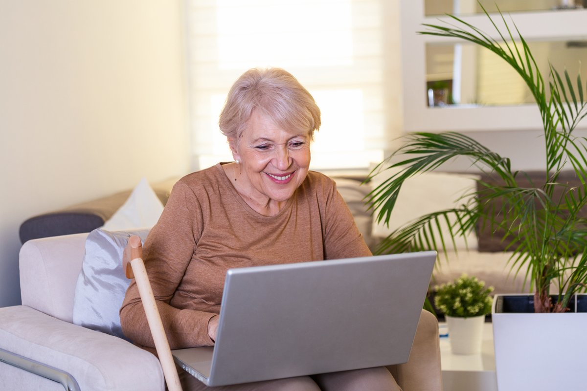 Woman participates in a video call on her laptop.