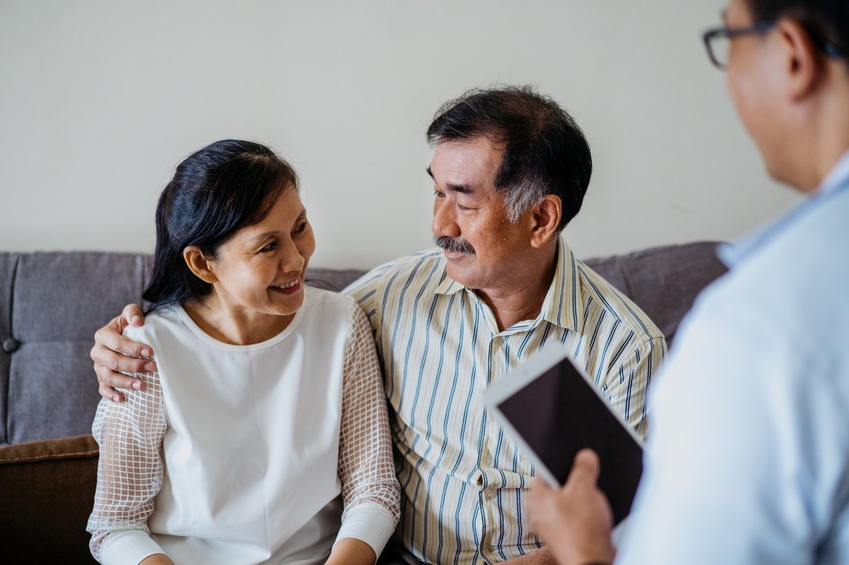 Couple talks with their doctor.