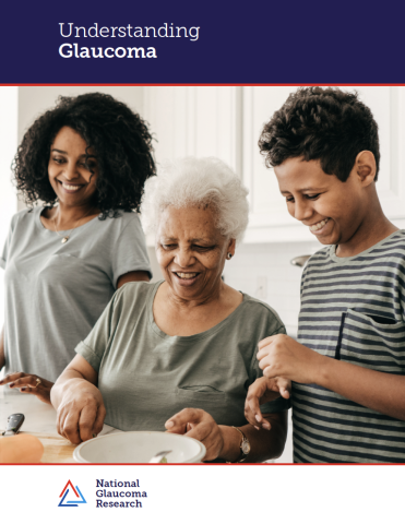 Three generations of a family smile as they prepare a meal together on the cover of Understanding Glaucoma brochure.