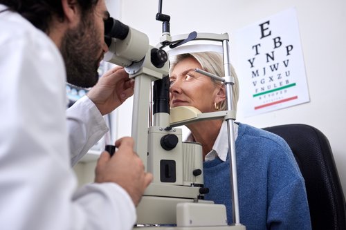 Woman getting eye exam.