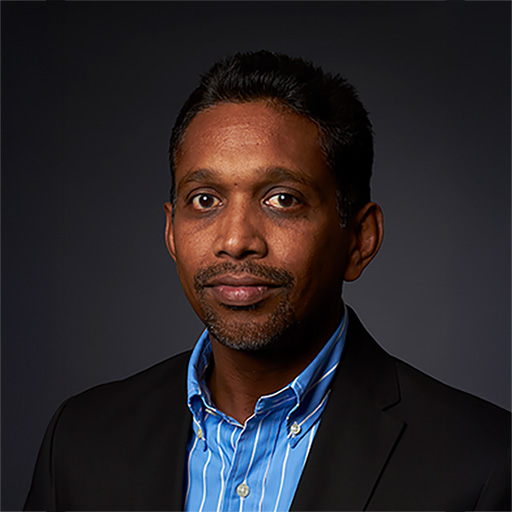 a headshot of Biju Thomas, PhD