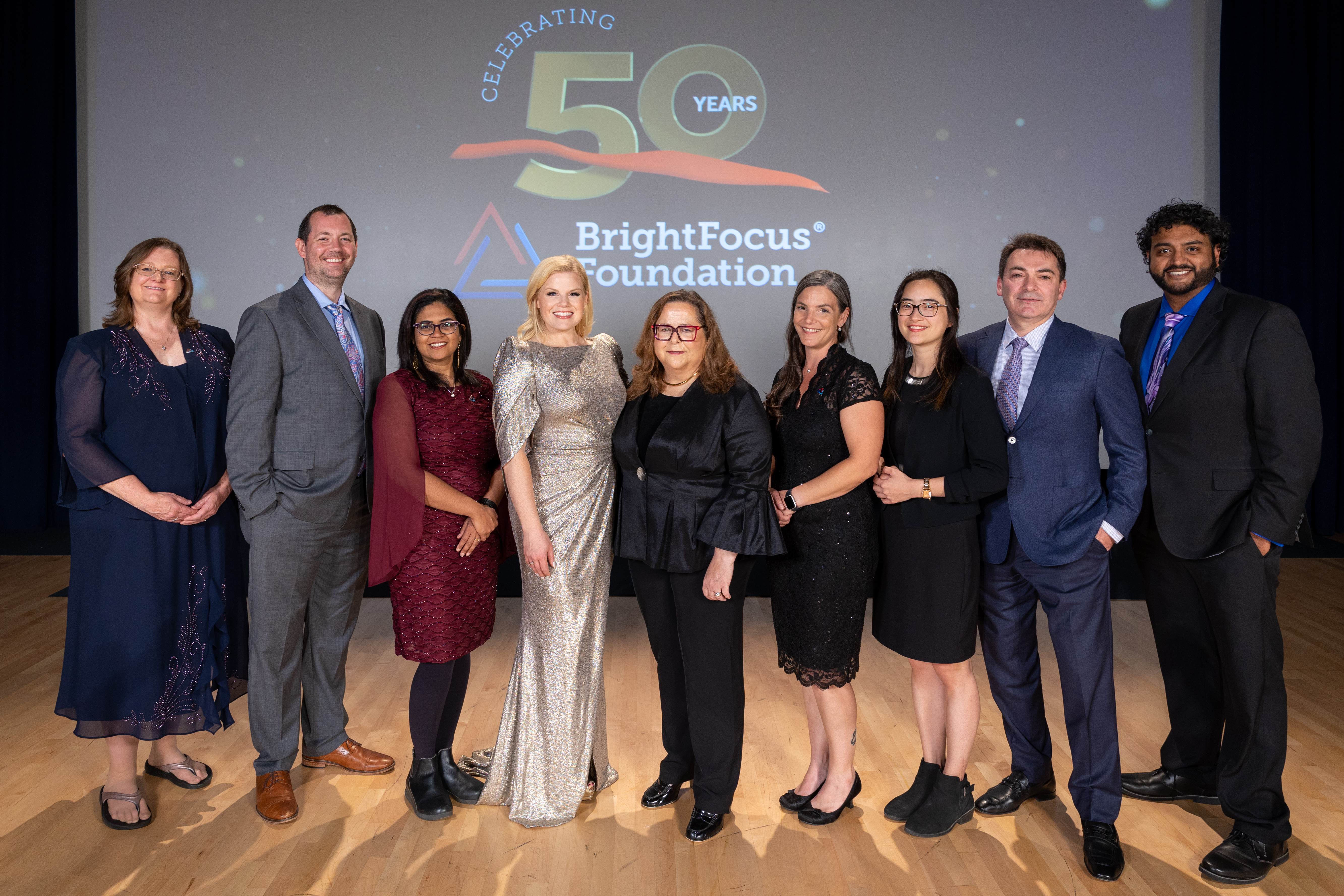 BrightFocus President and CEO Stacy Pagos Haller with BrightFocus Scientific Affairs team, cocktail scientists, and Megan Hilty.