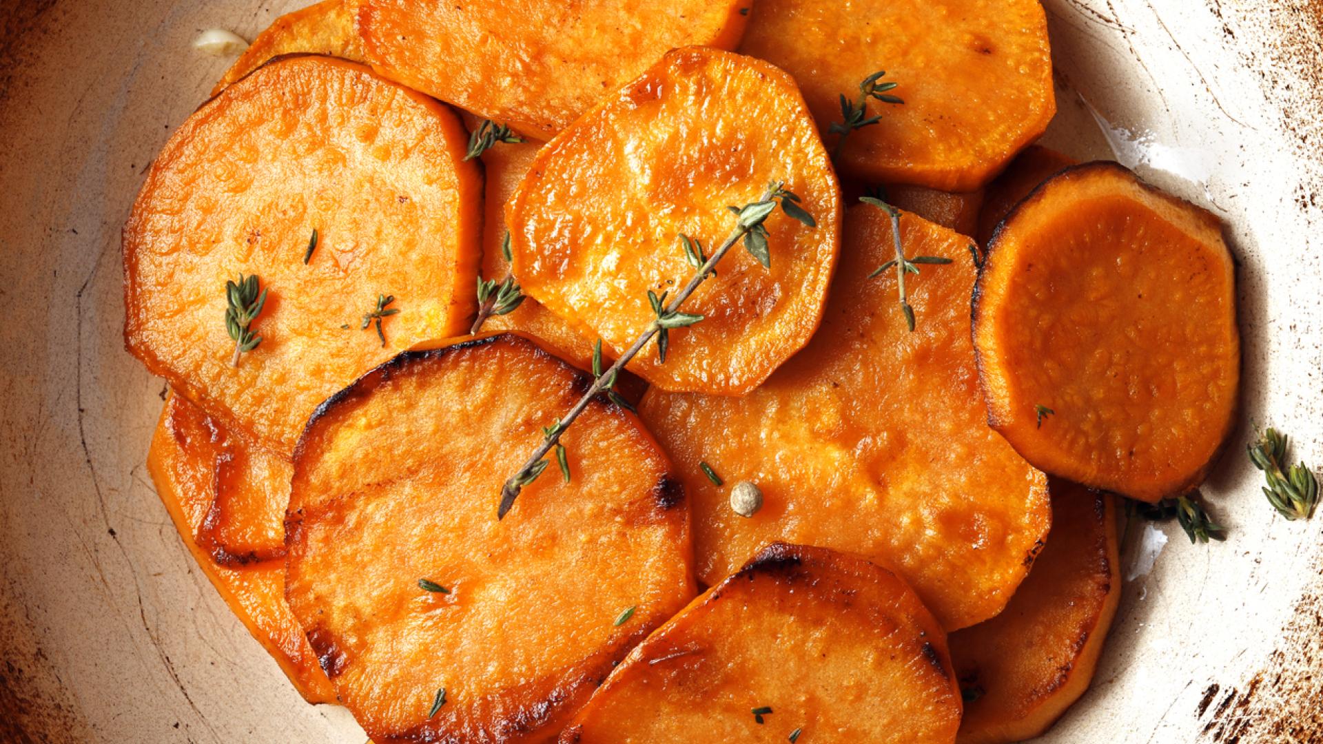 Slices of cooked sweet potatoes on a plate.