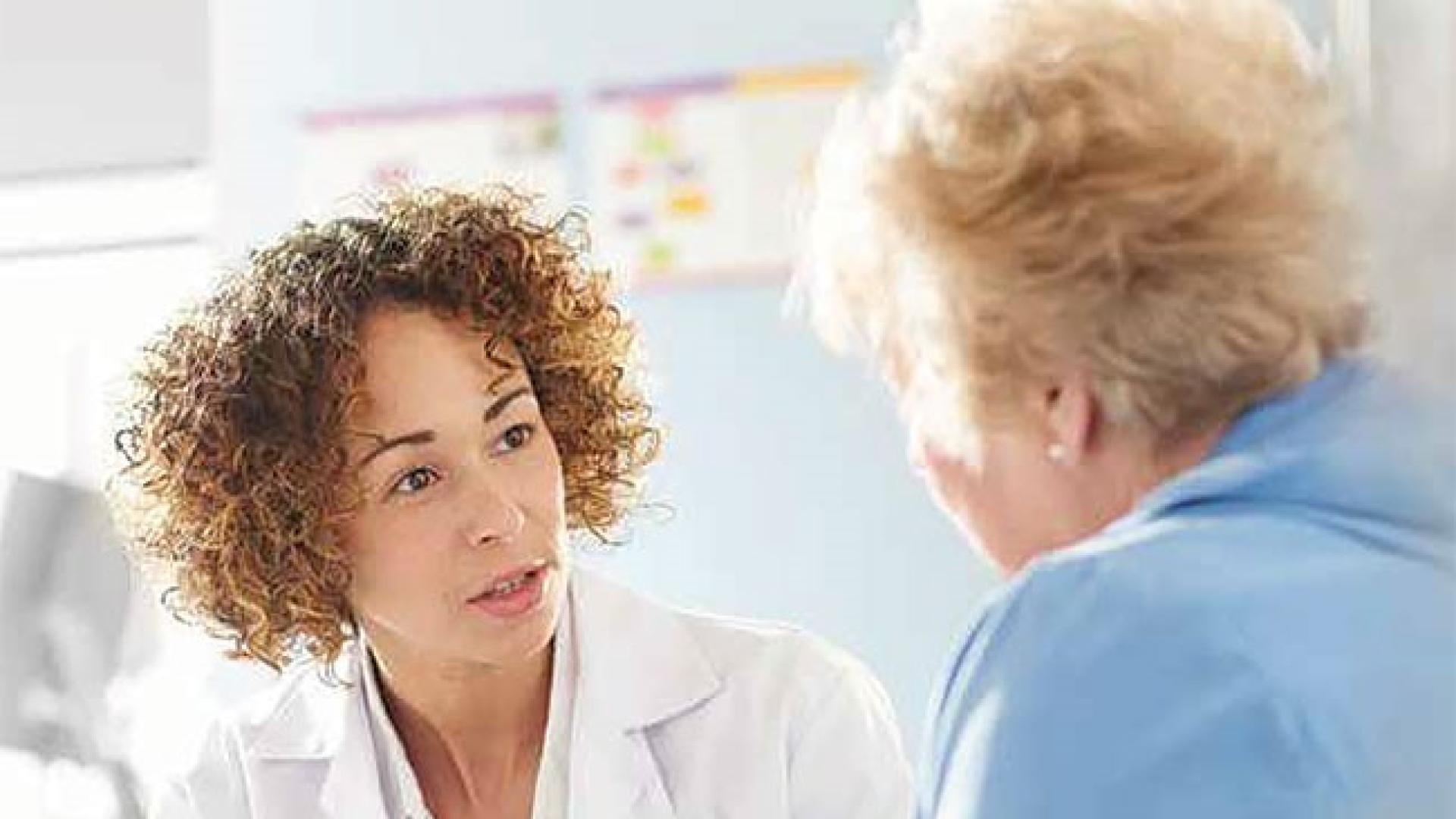 A doctor speaking with a patient.